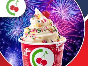 a vanilla cup of yogurt with sprinkles in a branded cup with a background of fireworks